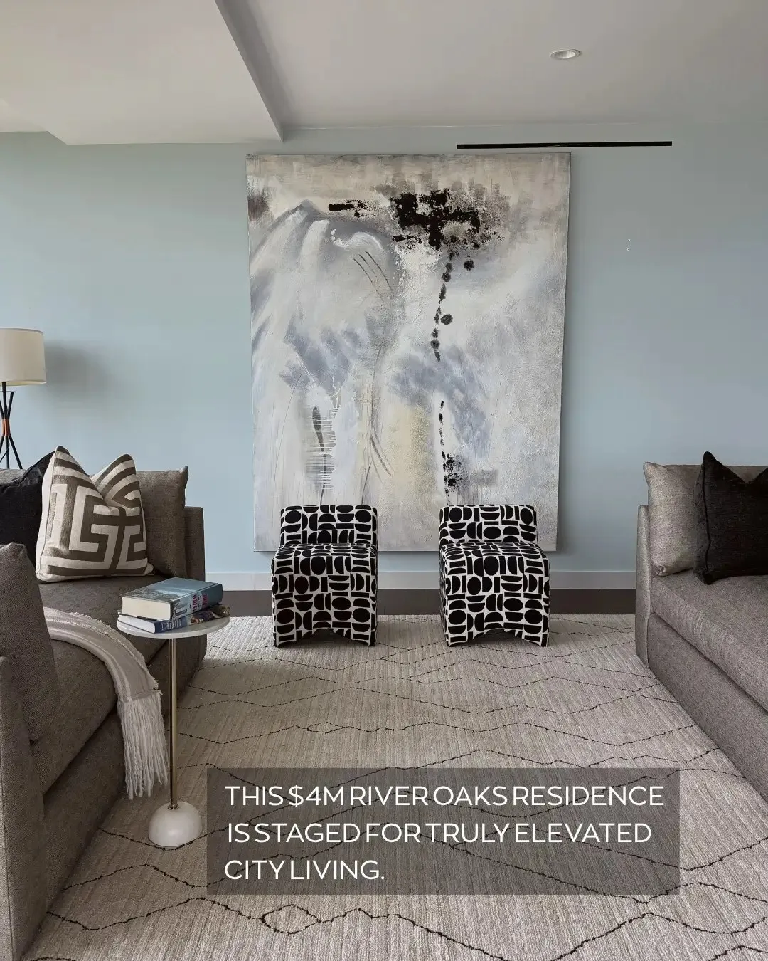Luxe Design Group post: a staged living room with an oversized abstract painting, captioned “This $4M River Oaks residence is staged for truly elevated city living.”